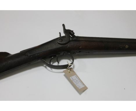 A PERCUSSION SPORTING GUN & FLASK. A double-barrelled percussion sporting gun with worm damaged stock. In need of repair/reno