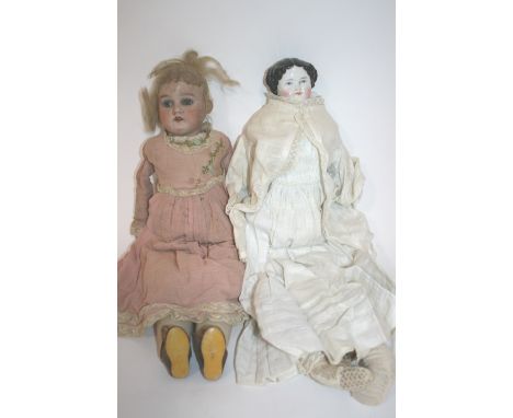 BISQUE HEAD DOLL & CHINA HEAD DOLL with a bisque head and shoulder plate,with weighted blue eyes, open mouth, and porcelain h