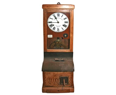 GWR RAILWAY CLOCKING IN CLOCK made by the National Time Recorder Co Ltd, with an oak case and glass front. With a plaque insi