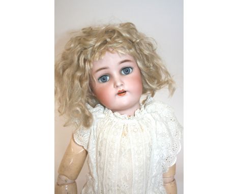 SIMON & HALBIG FOR KAMMER & REINHARDT DOLL a large doll with weighted blue eyes, open mouth and pierced ears. Marked, Simon &