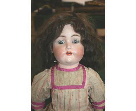 SIMON & HALBIG FOR KAMMER & REINHARDT DOLL with weighted blue eyes and open mouth, the head moves from side to side as the le