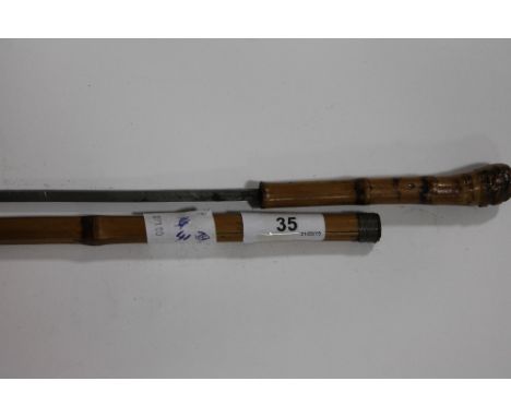 A SWORDSTICK. A Bamboo cane mounted swordstick, with square form tapering blade, 22.3/4" in length.