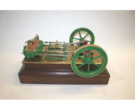 MODEL STEAM ENGINE - MILL ENGINE a twin cylinder engine with twin flywheels, mounted on a brass and wooden plinth. Wooden pli