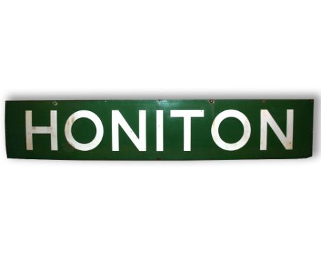 RAILWAY SIGN - HONITON an enamel railway sign from Honiton, with white lettering on a green background. 244 by 46cms *This si