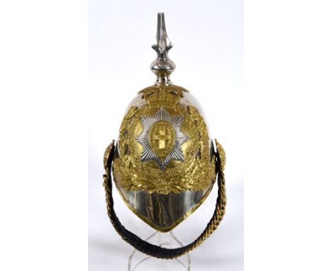 A LIFE GUARDS HELMET. A Trooper in the Lifeguards Helmet, with chinstrap and inner and the plume holder present. The QE11 per