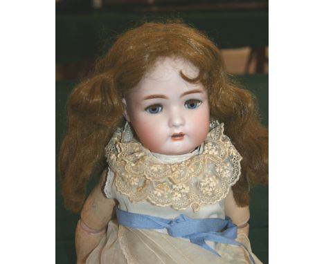 SIMON & HALBIG FOR KAMMER & REINHARDT DOLL with weighted blue eyes, open mouth and pierced ears. Marked, S & H, K & R, 53. 20