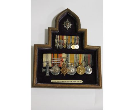 A MILITARY CROSS GROUP OF SIX MEDALS TO COL J E GIBBS MC C GDS. A framed and mounted group consisting of a  Military Cross  e