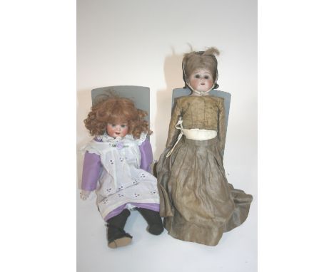 ERNST HEUBACH DOLL with fixed blue eyes and open mouth, Model 300. Also with a small bisque head doll with weighted brown eye