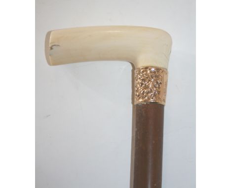 IVORY & GOLD MOUNTED WALKING STICK a walking stick with ivory handle and a decorative 15ct gold collar, stamped EN, 15, 6.25,