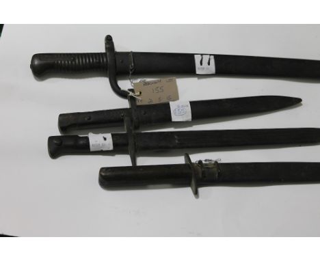 THREE BAYONETS AND A FIGHTING KNIFE. A French 1866 sabre bayonet with scabbard dated 1868 on the blade spine. An Italian mode