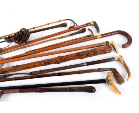 WALKING STICKS & RIDING CROPS - GOLF including a walking stick with a silver top, in the form of a Golf Club (London 1896, ma