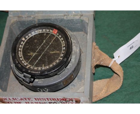 A CASED RAF COMPASS. A wooden cased RAF 1943 dated directional aircraft compass, type P8 with various markings. 3.3/4" dial.