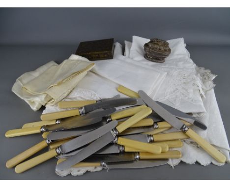 Quantity of table linen, loose collection of table knives, Ronson table lighter and an enamel decorated brass lidded box