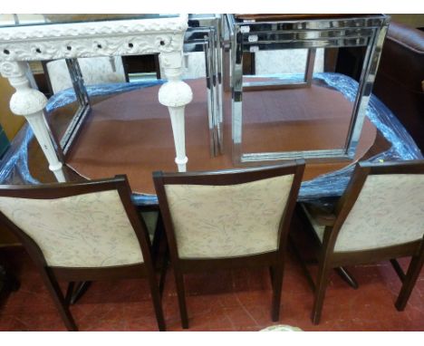 Twin pedestal dining table with six (four plus two) chairs with light floral upholstery