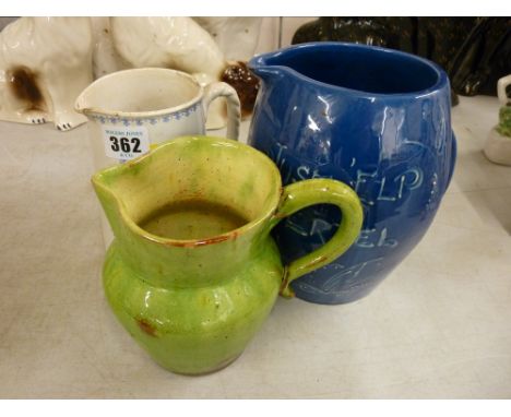 CH Brannam Barum ware jug, slip decorated and with wording 'Just Elp Yerzel', no. 1542 to the base and two other vintage jugs