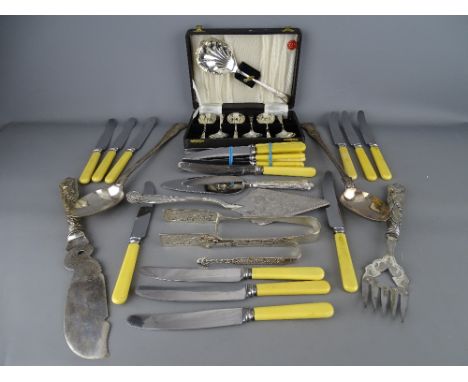 Quantity of EP and silver cutlery including two large King's pattern serving spoons, a fish slice and fork set with repousse 