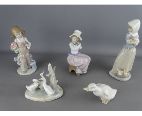 Lladro porcelain figurine of a young girl with a bird and four various Nao figurines of girls and animals
