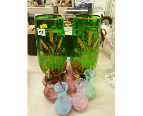 Collection of colourful glass vases including three Caithness examples