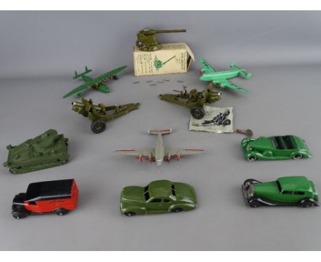 Seven Dinky diecast vehicles and planes, a Meccano example, two Howitzers, unknown maker and a W Britain two pounder anti-air