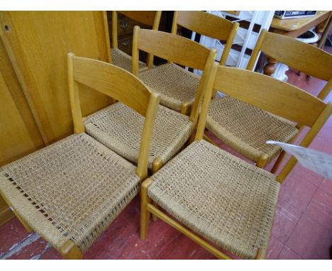 Set of six stylish light wood wicker seated dining chairs