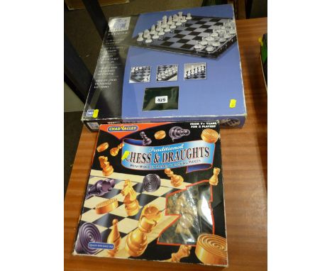 Boxed glass chess set and one other by Chad Valley