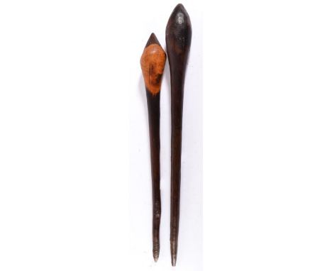Two 19th Century Australian Aboriginal Clubs, each with pointed ovoid head and tapering haft with pointed butt, of dark rich 