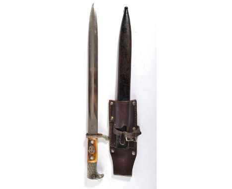 A German Third Reich Police Dagger, one side of the single edge fullered steel blade stamped with maker's visored helmet logo