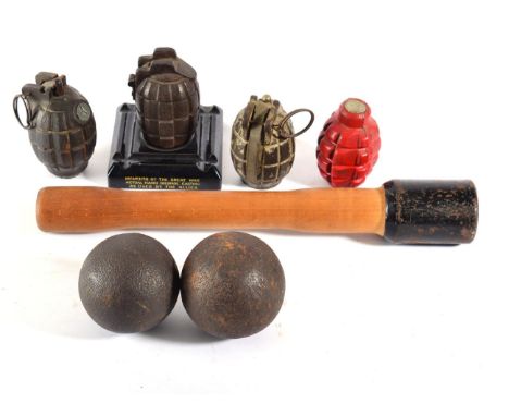 Three Deactivated Mills Bombs, comprising a 36M example and two others, one as a cutaway desk ornament, the other a casing on