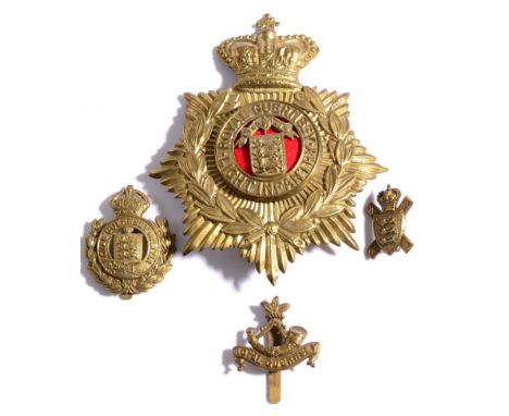 An OR's Brass Helmet Plate to the Royal Guernsey Light Infantry, the centre plate with scarlet felt backing; also, a Royal Gu