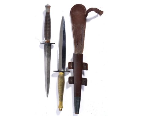 A Second Pattern Fighting Knife, with hand forged blade, the blued crossguard double struck with broad arrow B2, with hatched