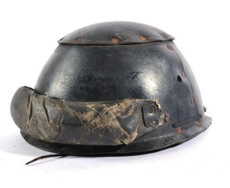 A Second World War Royal Armoured Corps 1940 Crash Helmet, constructed from three pieces of black hard fibre rivetted togethe