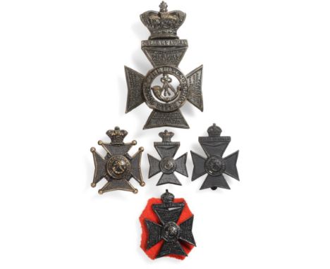 A Victorian King's Royal Rifle Corps OR's Foreign Service Helmet Plate, in blackened metal, together with a cap badge and a c