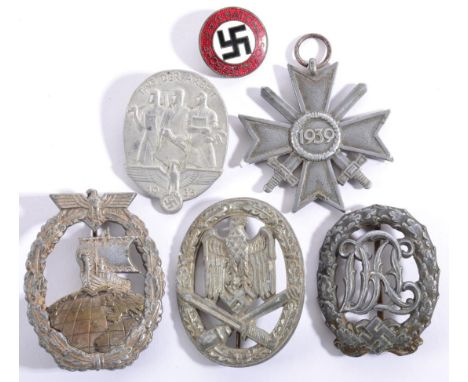 German Third Reich Badges: comprising a General Assault badge; an Auxiliary Cruiser badge; a War Merit Cross; an N.S.D.A.P. e