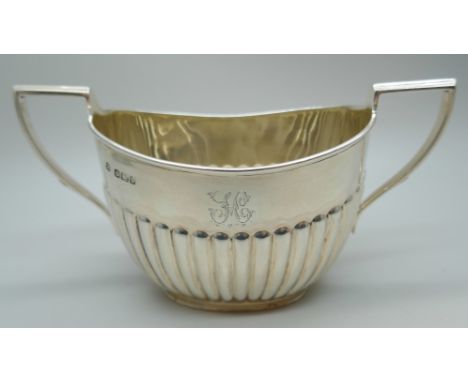 A Victorian two handled suagar basin with fluted detail, Sheffield 1894, 104g, 7.2cm height including handle