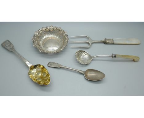 A Georgian silver berry spoon, a late Victorian pierced silver dish, 54g total, a silver sifter spoon with mother of pearl ha