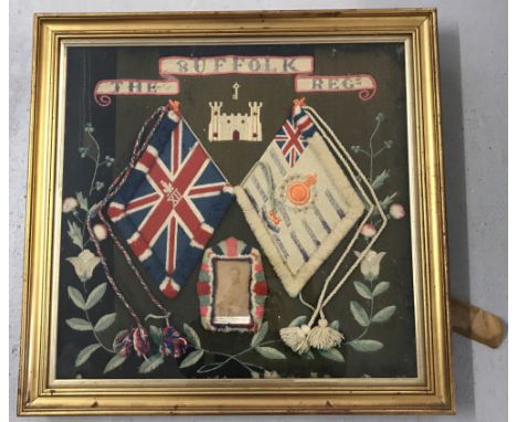A framed and glazed mid to late 19th Century wool work panel of The Suffolk Regiment.Panel depicts the union flag and regimen