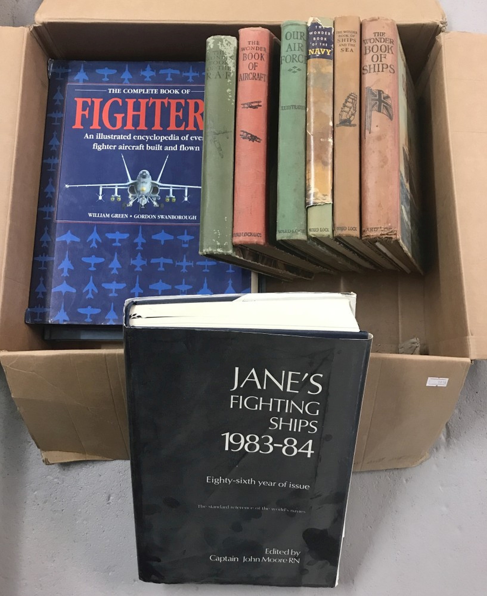 A Collection Of Military Related Books To Include Jane's Fighting Ships.