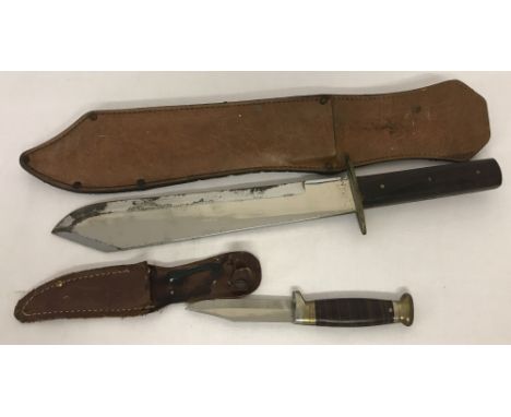 2 vintage knives in leather sheath's.A wooden handled Bowie knife together with a small hunting knife.