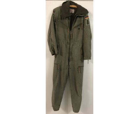 A khaki green German army flight suit complete with full length detachable fleece lining.Utility pockets to both interior and