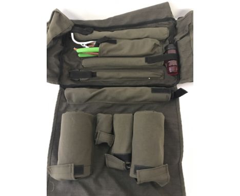 British Army 81mm mortar cleaning kit in a green canvas bag with black straps.