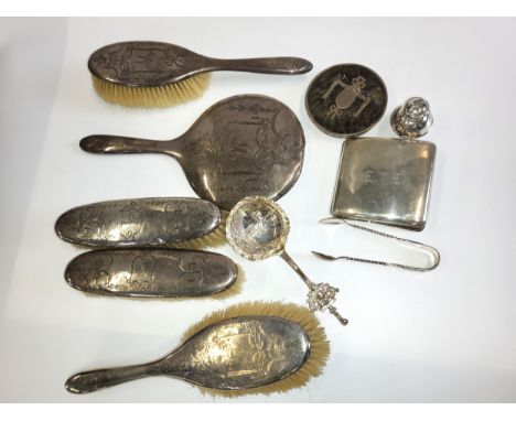 A selection of silver including a vanity set of two natural bristle hairbrushes, two natural bristle  clothes brushes and a h