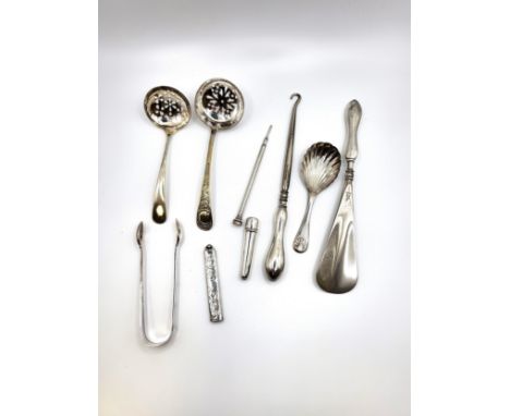 A stainless steel shoe horn with a silver handle, marks rubbed, a stainless steel handle and silver button hook Crisford &amp