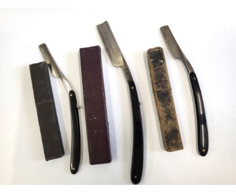 Three vintage cut throat razors in cases; two by Stacy, London (98 Newgate Street),  and one 'Real Old English Razor'. 