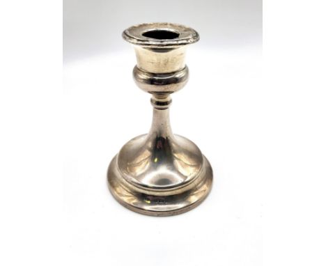 A short silver candlestick Steinhart &amp; Co, Birmingham  1923. Weighted base and damaged holder. 10cm. 152gms 