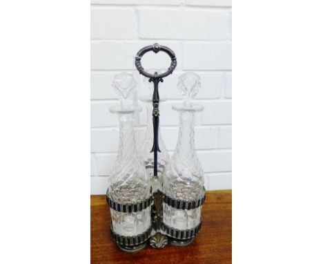 An Epns triple decanter stand complete with a set of three cut glass decanters and stoppers,  42cm high