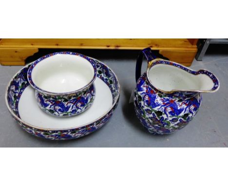 A Royal Doulton three piece toilet set comprising basin and ewer and chamber pot (3) 