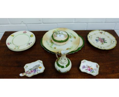 A mixed lot to include four Royal Doulton plates, two blush ivory porcelain style plates, a part porcelain dressing table set