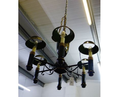 A green toile light fitting with six branches