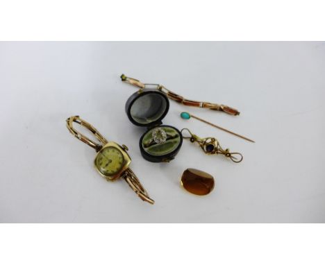 A mixed lot to include a 9 carat gold amethyst brooch, an opal stick pin, 9 carat gold cased wristwatch, scrap 9 carat gold d