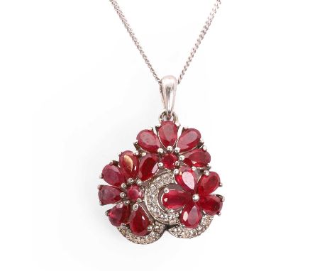 A ruby and white sapphire floral pendant,  with pear cut rubies and round cut white sapphires, all claw set, 20mm x 26mm, rub